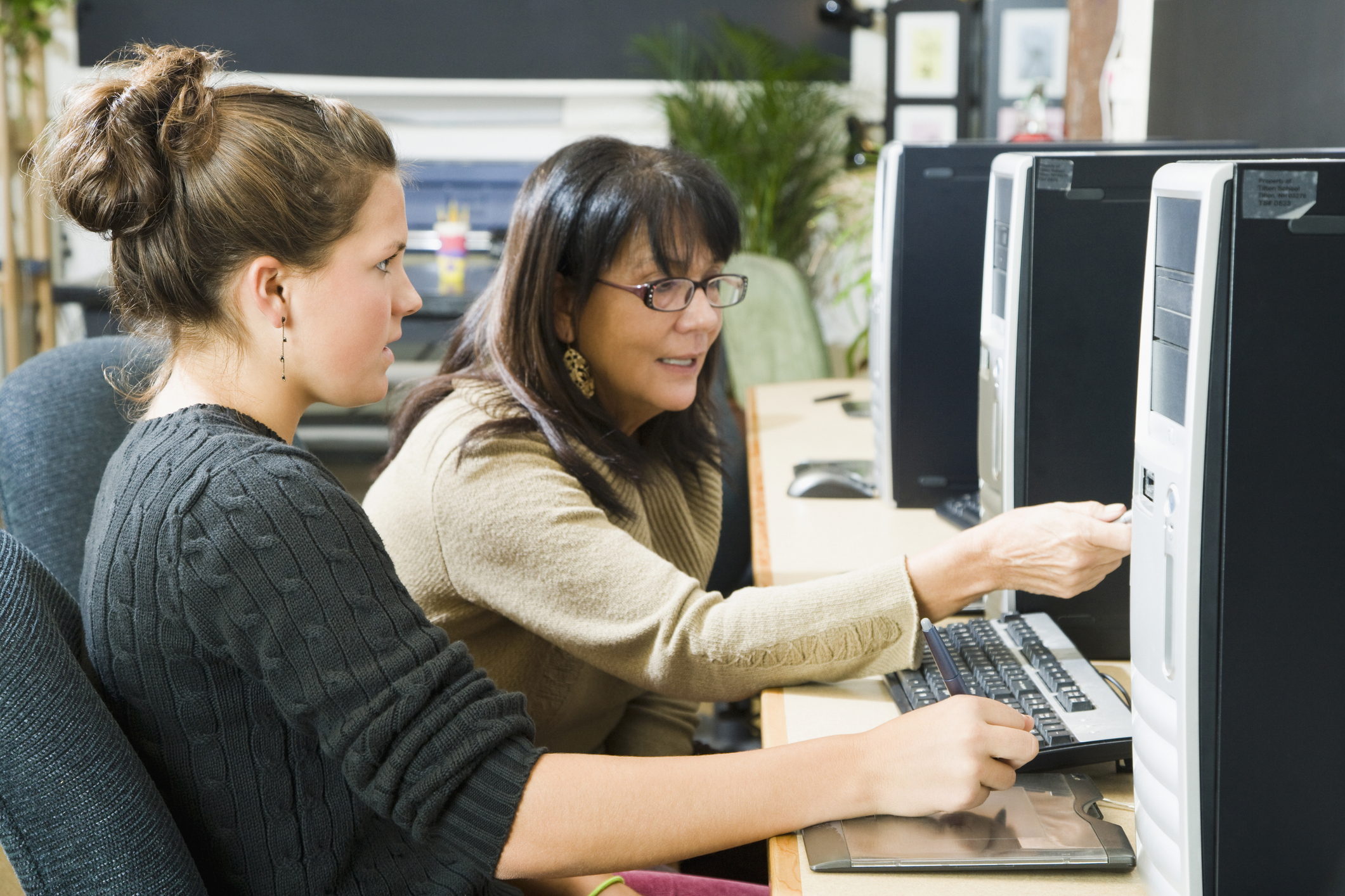 two women working on computer