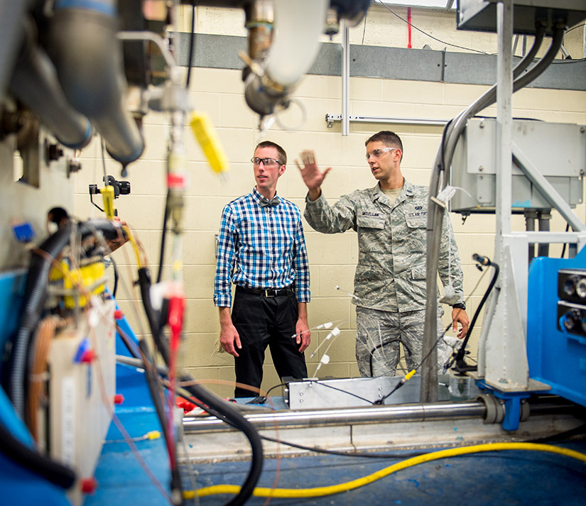 photo of people inspecting equipment